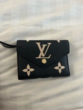 Louis Vuitton Victorine Black Wallet with Beige Monogram Accents